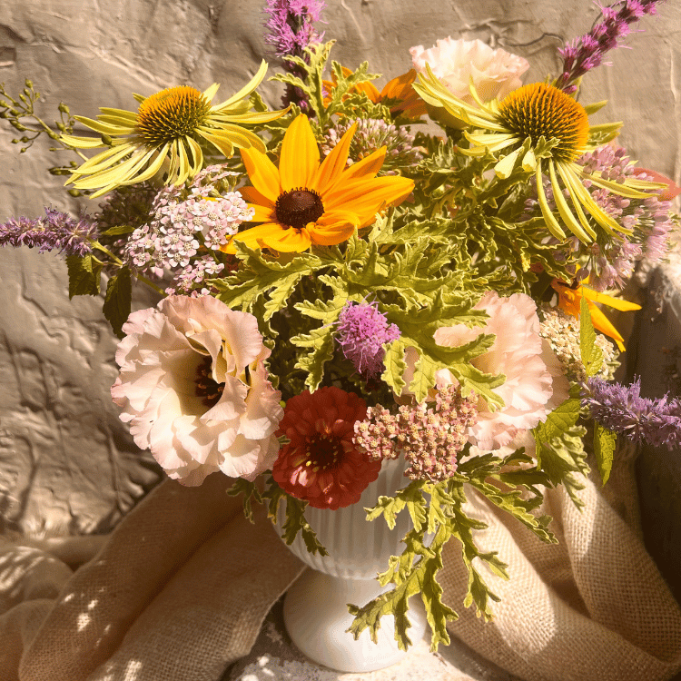 local sustainable flowers in a recycled vase